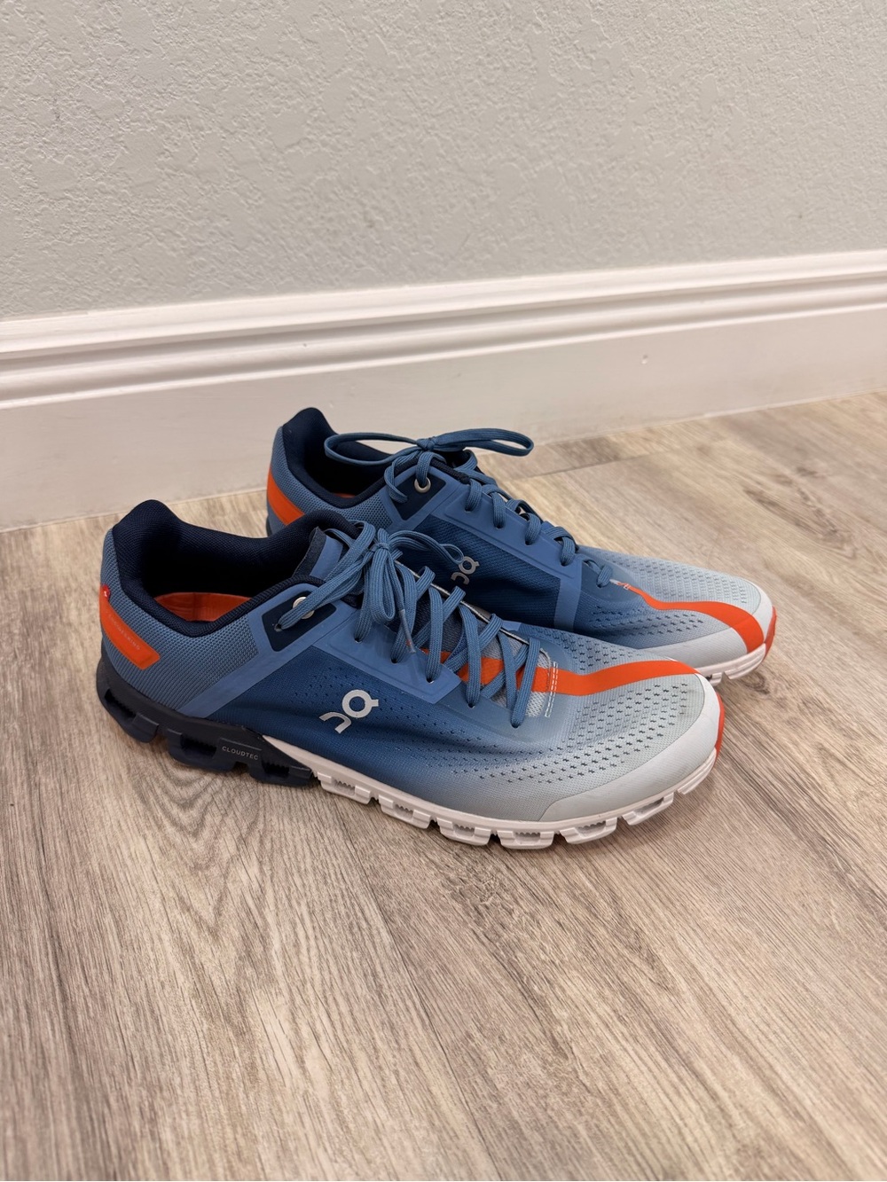 On Running Men's Blue Athletic Shoes with Orange Accents